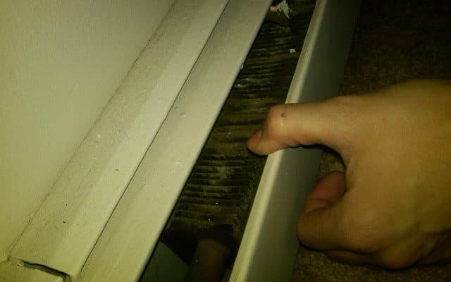 Any idea why after turning on an electric baseboard heater in my basement it would generate a strong sickly sweet smell?